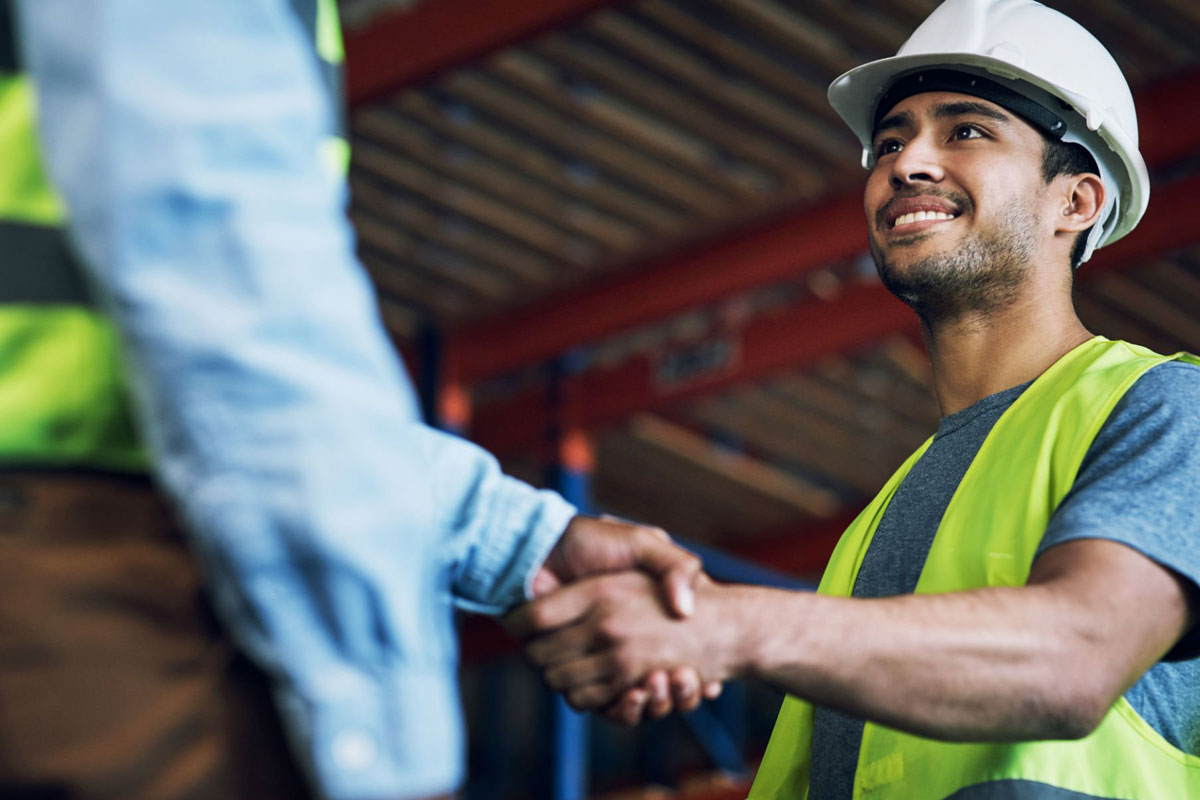 Workers shaking hands